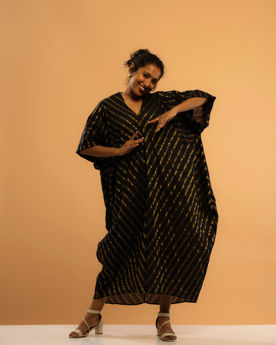 Nishagandhi | Gold Striped Black Kasavu Kaftan